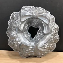 Vintage Heavy Aluminum Wreath Mold Christmas Holiday Cake Baking Bundt Pan. Please view photos for detail and condition.