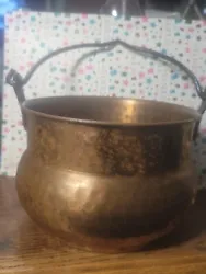 Add a touch of rustic charm to your fireplace with this vintage copper cauldron. Crafted from hammered copper, this...