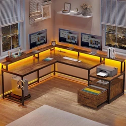 SEDETA Reversible L Shaped Desk with Monitor Riser and File Drawer. Large work area can hold three desktop computers...