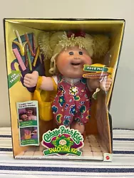 HAIR IS BLONDE. EYES ARE BLUE. THISCABBAGE PATCH KIDS DOLL IS NEW IN BOX. BOX IS WORN FROM SITTING IN ATTIC ALSO HAVING...