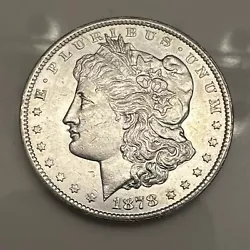 This 1878-CC Morgan Silver Dollar is a highly sought-after collectors item that will be a valuable addition to any...