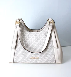 MICHAEL KORS Jcendre Détails sur ce produit : Matériel: PVC, cuir, métal doré, doublure textile Modèle ARLO LG CZ...