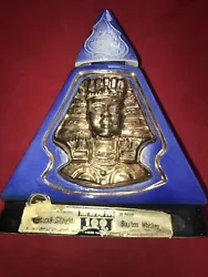 This vintage Jim Beam whiskey bottle decanter features an Egyptian pharaoh design, adding a unique touch to any...