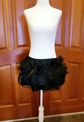 Adult 5-ruffled layers black TuTu skirt. Elastic waistband measures 12