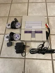 Super Nintendo Console SNES Tested Working Original Cables Power Supply. Tested and working SNES. Comes with 2...