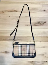 This Burberry crossbody is in fantastic preowned condition. There is one small crack in the leather near one of the...