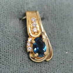 London blue topaz accented by 0.06 CTW diamonds.