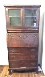 It has the old finish and original drawer pulls and keyhole covers. There is one key for all the locks.