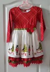 Add some festive flair to your little girls wardrobe with the Counting Daisies Girls Nutcracker Christmas Dress. This...