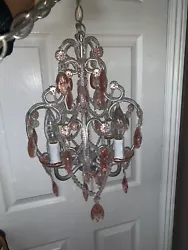 Hanging Chandelier. It is made of plastic or acrylic ?. It is NOT glass. Does need a little cleaning. you can see.
