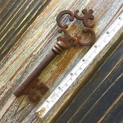 Large Cast Iron Victorian Key. Key Has A Rusted Antique Finish. Made of Cast Iron.