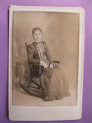 Woman in her Rocking Chair with original tissue paper. There is no ID to the cabinet card photo. Photographer is,...