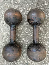 UP FOR BID A VINTAGE PAIR OF ROUND HEAD DUMBBELLS . I COULD NOT FIND ANY MARKINGS ON THEM TO TELL THE WEIGHT . I...