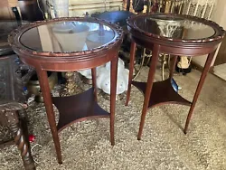 Add a touch of vintage elegance to your home with this pair of antique accent tables. Crafted from high-quality...