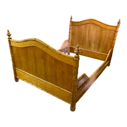 Both the headboard and footboard have a gradually curved peak all with round faux bamboo edges. It is detailed on all...