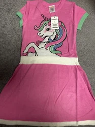 This adorable sweater dress features a crew neck and pullover closure. It is perfect for casual occasions and is made...