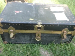 Trunk color is black. Had 2 leather handles.one on either side. Local pickup can be made available.