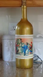 This is a 1.5 Lt Wine Bottle Lamp. Gold Frosted bottle. Inside bottle: 20 Mini White lights. Light cord exits through a...