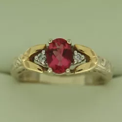 0.85 CT Genuine Pink Tourmaline (7x5 mm). 14K White Gold Ring W/ Yellow Gold Accents. Preowned but very good condition!