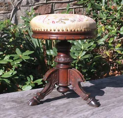Victorian 1870s-80s High Style Renaissance Revival Period Piano Stool. Black Walnut wood, carved, incised, three legs w...