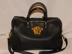 Authentic Versace bag that is in great condition. Top zipper closure. There is a little rubbing around the edges due to...