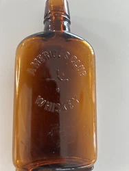 UP FOR SALE IS NICE ATTIC FIND. It was wrapped in newspaper. It is an America’s a club Whiskey bottle. Amber brown...