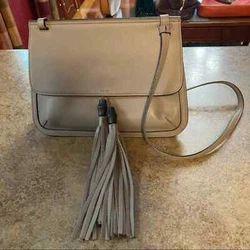 Excellent like new condition. Flap closure. Four internal pockets. Hand stitched. 9 1/4” high and 4 1/4” deep.