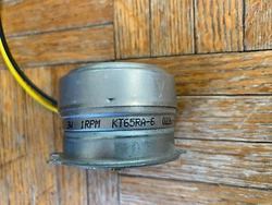 USED clock motor from discontinued sync clock systems. 24 VAC size 65 shaft 1RPM.
