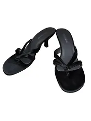 Elevate your style with these Fabulaire thong heels in black. Perfect for any occasion, these shoes are designed for...