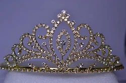 This is a large, ornate, gold-tone rhinestone tiara with two attached combs. All the rhinestones are bright and...