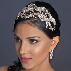 With antique light gold plating encrusted with baguette and round cut rhinestones this headpiece truly shines! “What...