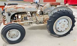 Project Ford tractor. Unsure of exact year/model etc. Motor does not turn, front tires still holding air and in decent...