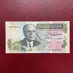 Tunisie billet 1/2 Dinar 1973 pick69a série A.6 15.10.1973État :SUP+/XF+Pli central Aucun épinglage Billet non...