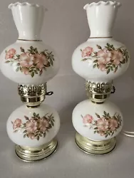 This vintage parlor lamp is a beautiful addition to any collectors home decor. The lamp features a pink floral design...