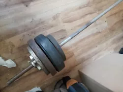 Olympic Bar with 8 Plates total. Weight unknown. Rhode Island area.