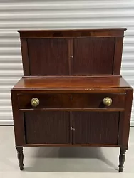Antique New England Sheraton Tambour Secretary Desk. Beautiful mahogany desk with top and tambour doors. Solid brass...