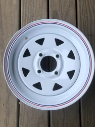 NEW 12X4 WHITE SPOKE WHEEL TRAILER. THERE IS A SLIGHT BEND RIGHT BY VALVE STEM HOLE. IT WILL NOT EFFECT THE FUNCTION OF...