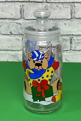 This vintage glass apothecary jar is a charming addition to your Christmas decor with its colorful teddy bear design....