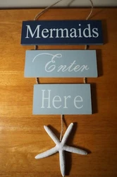 Beach Sign. Made of wood with polyresin starfish and rope hanger.