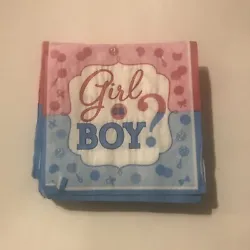A plastic bag full of gender reveal party items mostly buttons that say “Team Boy” and “Team Girl” pins and...