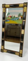 Mirror features black and gold gilt decorated turned half columns with block corners having brass stamped rosettes, 2...
