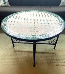 Handcrafted round Moroccan indoor/outdoor mosaic tile coffee table. Made in Morocco. Will fit vertically in back seat...