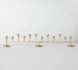 Brand new, hard to find Hearth and Hand Magnolia large antiqued metal (brass tone) Candelabra. Beautiful addition to...