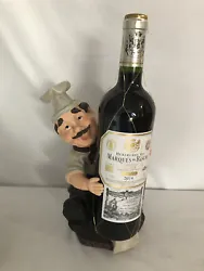 Cute wine bottle holder in excellent used conditiom.