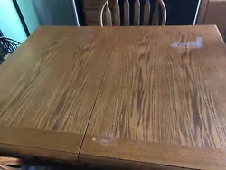 KITCHEN OR DINING ROOM TABLE. AND 6 CHAIRS. TABLE TOP COULD BE REFINISHED OTHERWISE NO SCRATCHES OR MARKINGS.