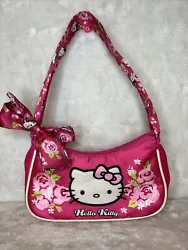 This pink Hello Kitty Sanrio purse is the perfect accessory for any fan of the iconic character. With a cute bow...