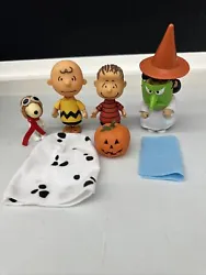 This Peanuts action figure lot features beloved characters Charlie Brown, Lucy, Linus, and Snoopy. The figures, made of...