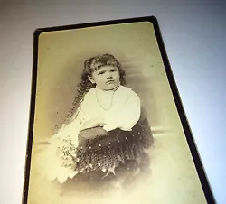 Wonderful antique CDV photograph of young girl with chubby cheeks! White flowers in hand, seated portrait! Dont miss...