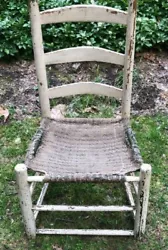 Very old primitive ladder back chair; old paint. I think the seat is original because it covers the original green...
