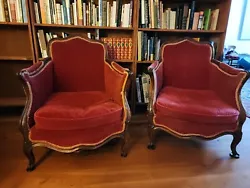 Beautiful pair of antique signed French bergaires. Old red felt uphostelery over walnut or fruit wood frame. Stamp...